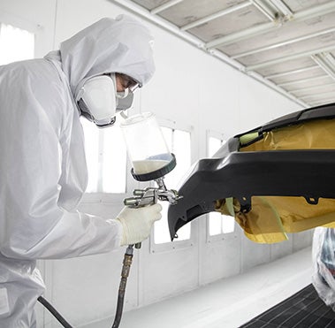 Collision Center Technician Painting a Vehicle | Wagner Toyota in McCook NE